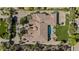 Top-down view of a home, showcasing the roof, pool, lawn, and basketball court layout at 5615 N Invergordon Rd, Paradise Valley, AZ 85253