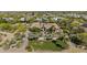 Expansive estate with mature trees, green lawn and circular driveway, a private oasis at 5615 N Invergordon Rd, Paradise Valley, AZ 85253
