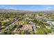 Aerial view of an estate that features a pristine pool and meticulously maintained lawn with desert backdrop at 5615 N Invergordon Rd, Paradise Valley, AZ 85253