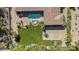 Birds-eye view of a home, focusing on pool, lawn, outdoor seating, and basketball court at 5615 N Invergordon Rd, Paradise Valley, AZ 85253