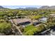 Beautiful estate with pool, spa, green lawn, and sports court, surrounded by desert landscape at 5615 N Invergordon Rd, Paradise Valley, AZ 85253