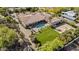 Estate featuring pool, spa, expansive lawn, outdoor fireplace, and sports court at 5615 N Invergordon Rd, Paradise Valley, AZ 85253