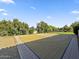 Full basketball court on beautiful lot with desert landscaping and flowering shrubs at 5615 N Invergordon Rd, Paradise Valley, AZ 85253