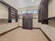 Large walk-in closet featuring custom shelves, drawers, and storage with carpet flooring at 5615 N Invergordon Rd, Paradise Valley, AZ 85253