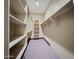 Spacious walk-in closet with built in shelving for optimal storage at 5615 N Invergordon Rd, Paradise Valley, AZ 85253