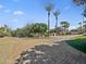 Circular brick driveway with mature trees and landscaping offering a grand entrance at 5615 N Invergordon Rd, Paradise Valley, AZ 85253
