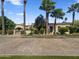Elegant estate featuring mature landscaping and a gated entrance at 5615 N Invergordon Rd, Paradise Valley, AZ 85253