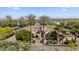 Stunning estate with lush landscaping, fountain, and palm trees welcomes you home at 5615 N Invergordon Rd, Paradise Valley, AZ 85253