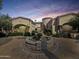 Stunning home with a grand fountain, circular driveway, and beautiful desert landscaping at 5615 N Invergordon Rd, Paradise Valley, AZ 85253