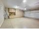 A spacious garage with epoxy floors, storage cabinets, and an automatic door provides ample space for parking and storage at 5615 N Invergordon Rd, Paradise Valley, AZ 85253