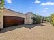 Exterior of garage with tile roof and landscaping at 5615 N Invergordon Rd, Paradise Valley, AZ 85253