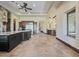 Gourmet kitchen boasts stainless steel appliances, an island, and stone accents, creating a chef's dream at 5615 N Invergordon Rd, Paradise Valley, AZ 85253