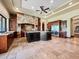 Gourmet kitchen featuring a large island, stone accents, and professional stainless steel appliances at 5615 N Invergordon Rd, Paradise Valley, AZ 85253