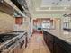 Gourmet kitchen features stone accents, professional-grade stainless steel appliances, and a large center island at 5615 N Invergordon Rd, Paradise Valley, AZ 85253