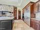 Gourmet kitchen showcases professional-grade stainless steel appliances, stone accents, and a large center island at 5615 N Invergordon Rd, Paradise Valley, AZ 85253