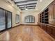 Open living room with wood floors, built-in shelves, and plenty of natural light at 5615 N Invergordon Rd, Paradise Valley, AZ 85253