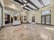 Open-concept living space with exposed beams, tile flooring, and seamless indoor-outdoor flow at 5615 N Invergordon Rd, Paradise Valley, AZ 85253