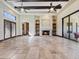 Open living area with fireplace, built-in shelves, and natural light from a large window at 5615 N Invergordon Rd, Paradise Valley, AZ 85253