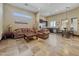 Spacious open-concept living area features stone floors, recessed lighting, and seamlessly connects to the kitchen and dining room at 5615 N Invergordon Rd, Paradise Valley, AZ 85253