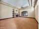 Spacious living room featuring a detailed fireplace, ceiling fan, and neutral carpet at 5615 N Invergordon Rd, Paradise Valley, AZ 85253