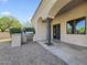 Outdoor kitchen area with built-in grill, countertop, and a tile patio at 5615 N Invergordon Rd, Paradise Valley, AZ 85253