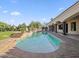 Swimming pool with spa and surrounding patio with outdoor bar area at 5615 N Invergordon Rd, Paradise Valley, AZ 85253