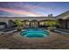 Inviting pool and spa surrounded by lush landscaping, perfect for relaxation and entertaining at 5615 N Invergordon Rd, Paradise Valley, AZ 85253