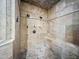 Walk-in shower fully tiled with multiple shower heads and a bench seat at 5615 N Invergordon Rd, Paradise Valley, AZ 85253