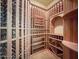 Spacious wine cellar with custom wood racks designed for extensive bottle storage at 5615 N Invergordon Rd, Paradise Valley, AZ 85253