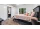 Bright bedroom featuring a cozy bed, large window, closet, and calm setting at 5704 E Aire Libre Ave # 1246, Scottsdale, AZ 85254