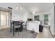 Cozy dining area with chandelier, adjacent to kitchen with updated appliances and natural light at 5704 E Aire Libre Ave # 1246, Scottsdale, AZ 85254
