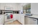 Efficient kitchen with white cabinets, modern appliances, tile backsplash, and ample counter space at 5704 E Aire Libre Ave # 1246, Scottsdale, AZ 85254