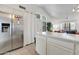 Open concept kitchen with stainless steel appliances, breakfast bar, and lots of natural light at 5704 E Aire Libre Ave # 1246, Scottsdale, AZ 85254