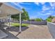 Expansive backyard with gravel, patio, grassy area, mature tree, and ample outdoor space at 6749 E Ellis St, Mesa, AZ 85205
