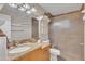 Well-lit bathroom featuring granite counters, a modern sink, and a glass-enclosed shower at 6749 E Ellis St, Mesa, AZ 85205