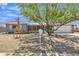 Inviting single-story home featuring desert landscaping, covered porch, and two-car garage at 6749 E Ellis St, Mesa, AZ 85205