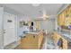 Kitchen with an island, granite countertops, stainless steel appliances, and adjacent dining area at 6749 E Ellis St, Mesa, AZ 85205