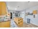Spacious kitchen featuring island cooktop, stainless steel appliances, and ample cabinet space at 6749 E Ellis St, Mesa, AZ 85205