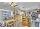 Bright kitchen features an island, stainless steel appliances, and a dining area with sliding door at 6749 E Ellis St, Mesa, AZ 85205