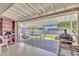 Spacious covered patio with brick flooring, perfect for outdoor dining and relaxation at 6749 E Ellis St, Mesa, AZ 85205