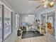 Sun room with a desk, windows, sliding doors and laminate floor at 6749 E Ellis St, Mesa, AZ 85205