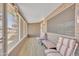 Comfortable sunroom featuring tile floors and cozy seating at 6749 E Ellis St, Mesa, AZ 85205