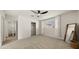 Cozy bedroom with a ceiling fan, ample closet space, and neutral carpeting at 6907 E Portland St, Scottsdale, AZ 85257