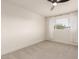 This bedroom features neutral walls, carpeted floors, and a window with white sheer curtains at 6907 E Portland St, Scottsdale, AZ 85257