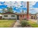 Charming single-story home with a well-maintained lawn and inviting desert landscaping at 6907 E Portland St, Scottsdale, AZ 85257