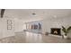Bright living room with fireplace and large windows overlooking a sparkling pool at 6907 E Portland St, Scottsdale, AZ 85257