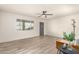 Bright living room with stylish wood flooring, a ceiling fan, and a serene atmosphere at 6907 E Portland St, Scottsdale, AZ 85257