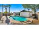 Backyard view featuring a private pool surrounded by palm trees and patio space at 6907 E Portland St, Scottsdale, AZ 85257