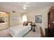 Cozy bedroom with ceiling fan, neutral walls, complemented by a comfortable bed and simple decor at 6945 E Cochise E Rd # 117, Paradise Valley, AZ 85253