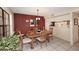 Open dining area with tile floors, dining table, and access to the kitchen at 6945 E Cochise E Rd # 117, Paradise Valley, AZ 85253